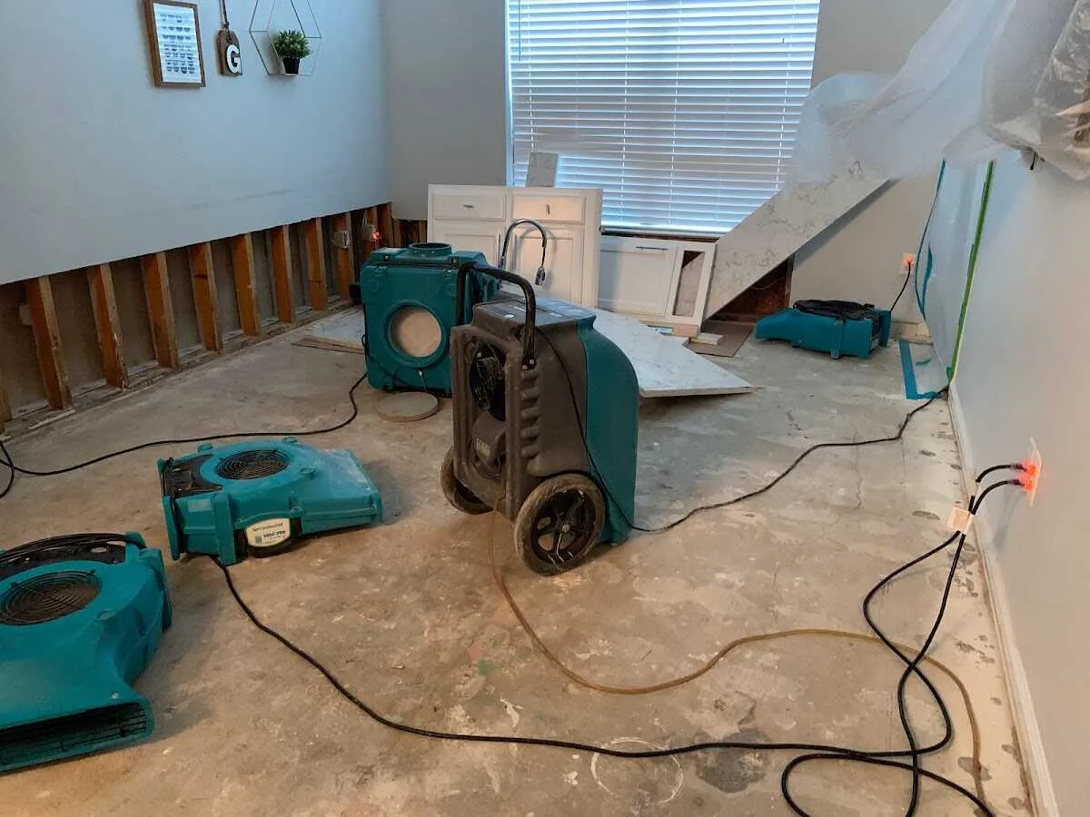 Dehumidifier in flood-cut room for Water Damage Restoration in Duxbury